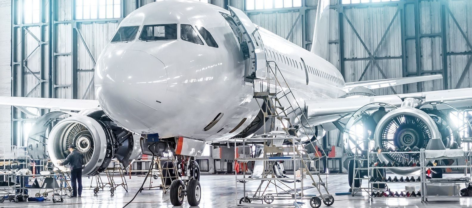 A white plane in a Warehouse